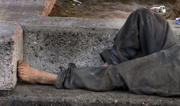 person sleeping on street