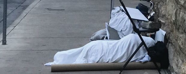 homeless people sleeping on the street