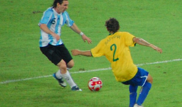 two men playing soccer