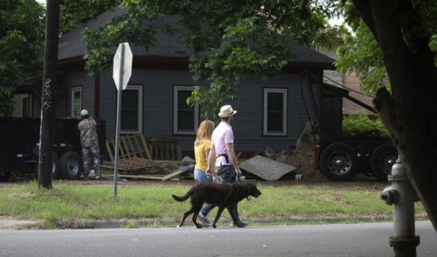 couple walking a dog