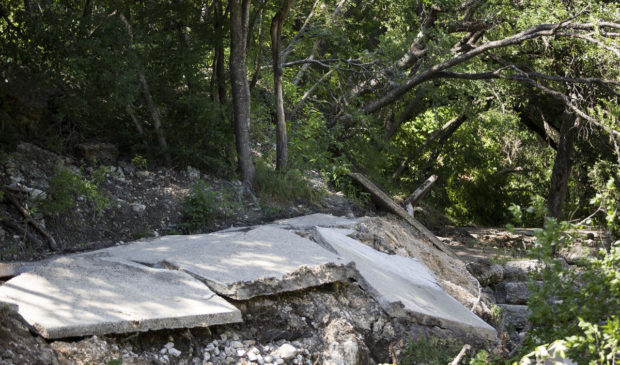 broken pavement on trail